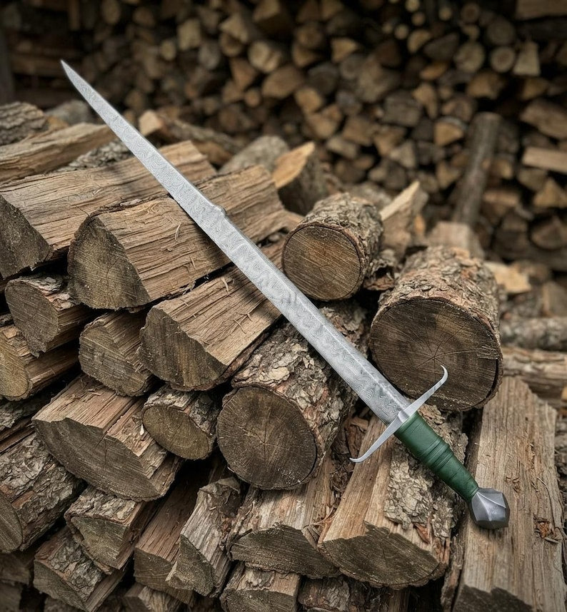 Woodland Falchion sword resting in its wood-core scabbard