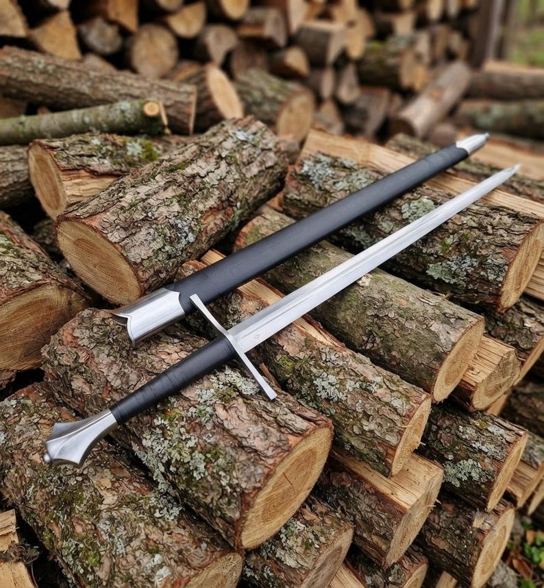 Hand forged Gothic longsword full view with leather scabbard