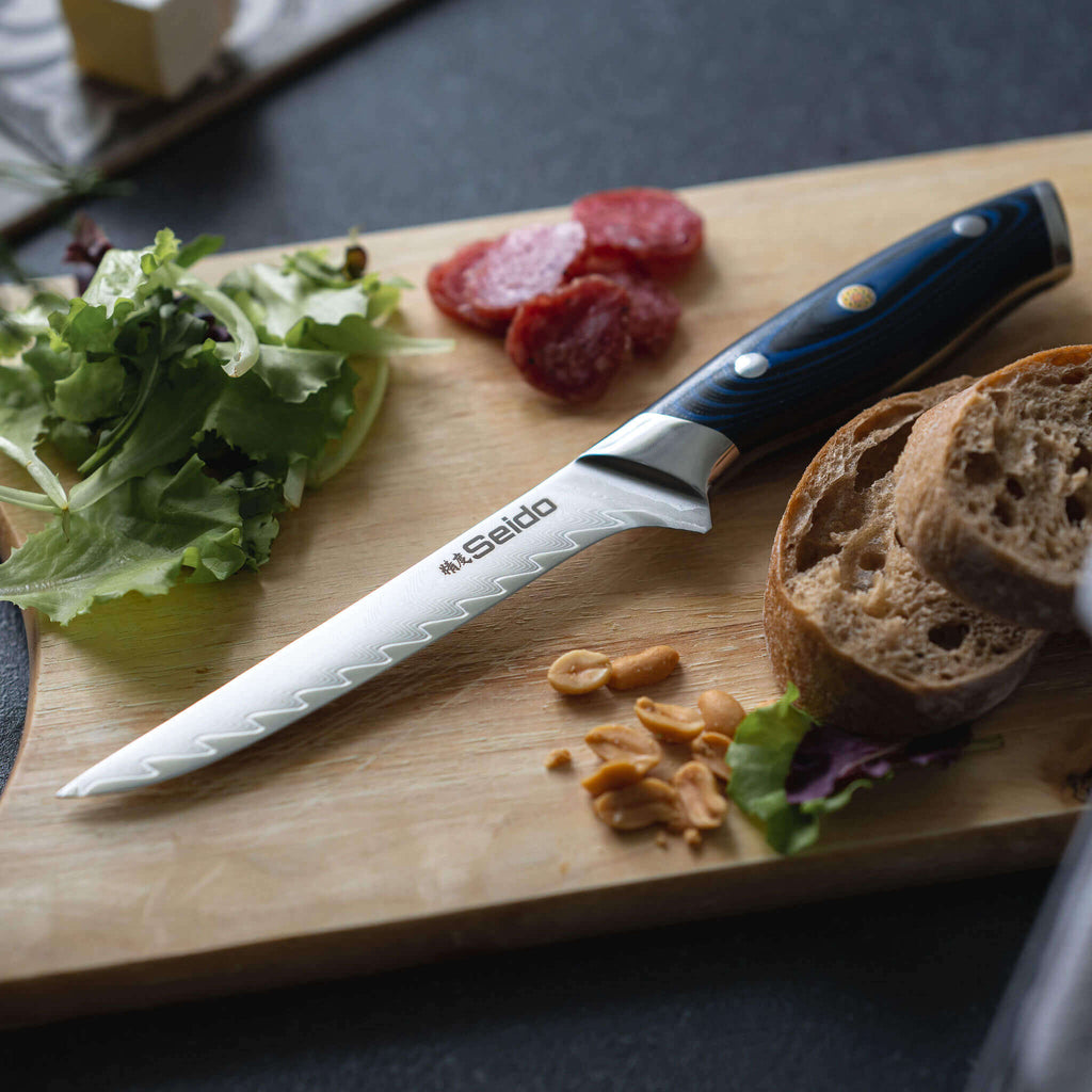 Kanpeki Damascus knife with ergonomic blue G10 and wood handle