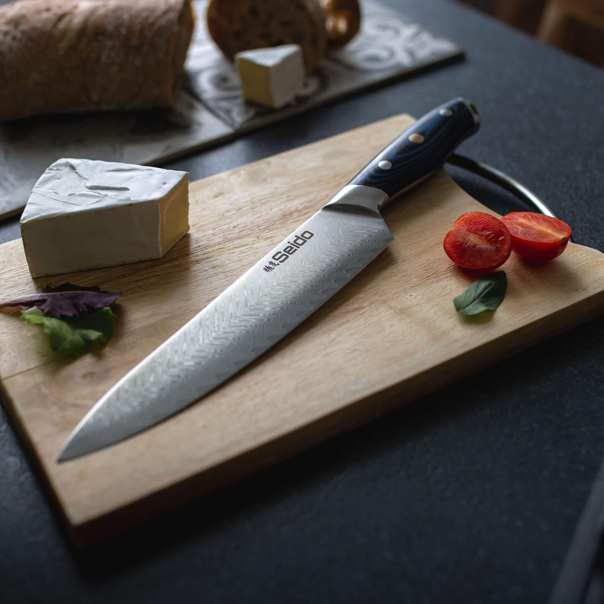 Kanpeki Damascus kitchen knife with razor-sharp edge and blue handle
