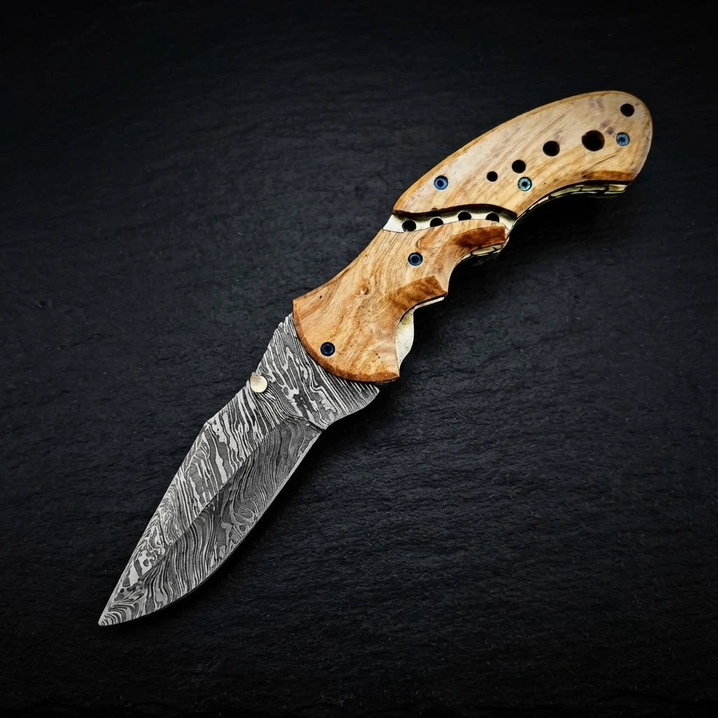 Damascus folding knife with olive burl wood handle – folded with sheath