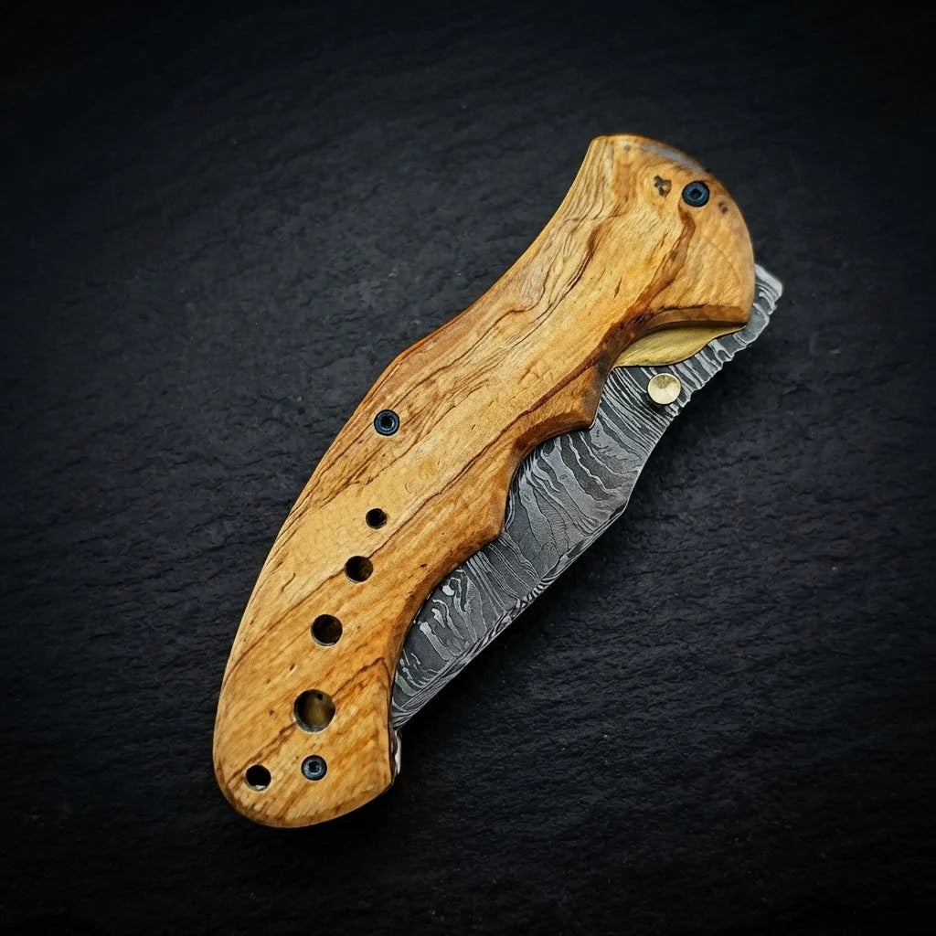 Damascus folding knife with olive burl wood handle – handle detail