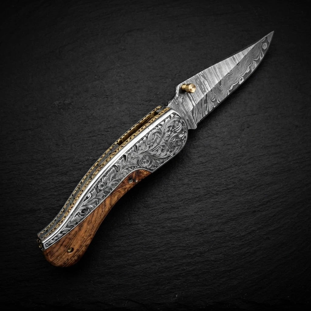 Olive wood folding pocket knife — Damascus steel blade close-up