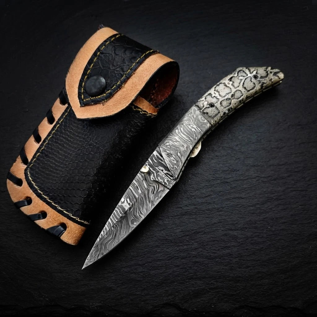 Scrimshaw camel bone folding knife with Damascus bolster and drop point blade – full view