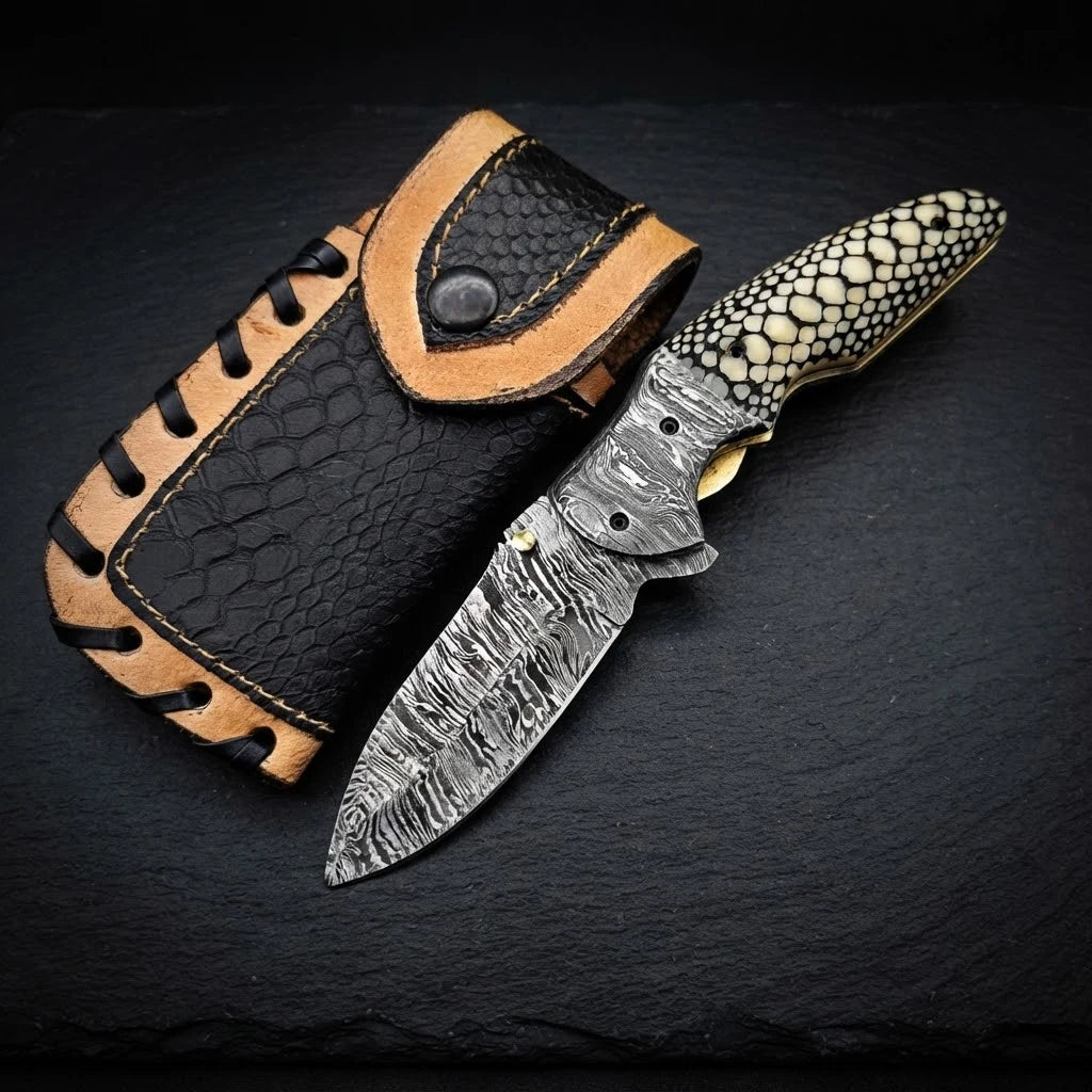 Scrimshaw camel bone folding pocket knife with Damascus bolster