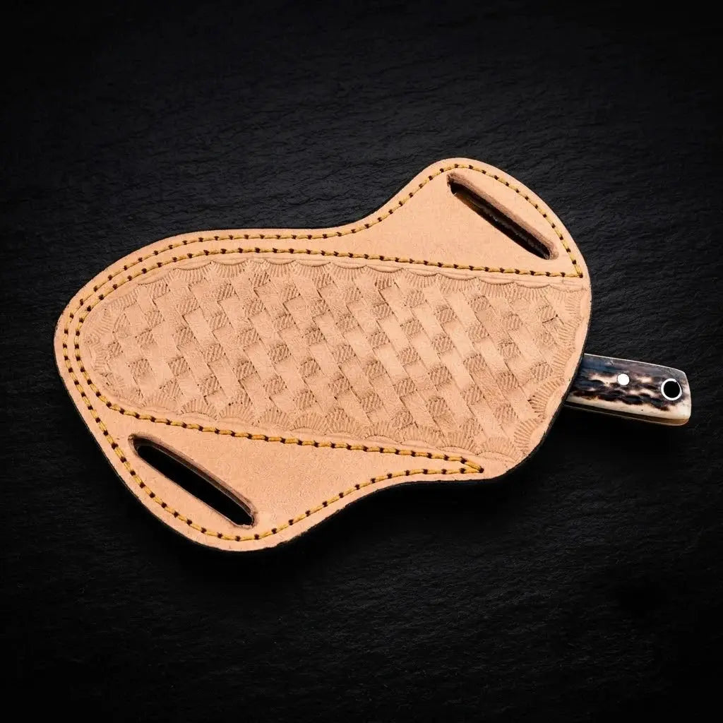 Stagmere skinner knife blade close-up with cross-draw leather sheath