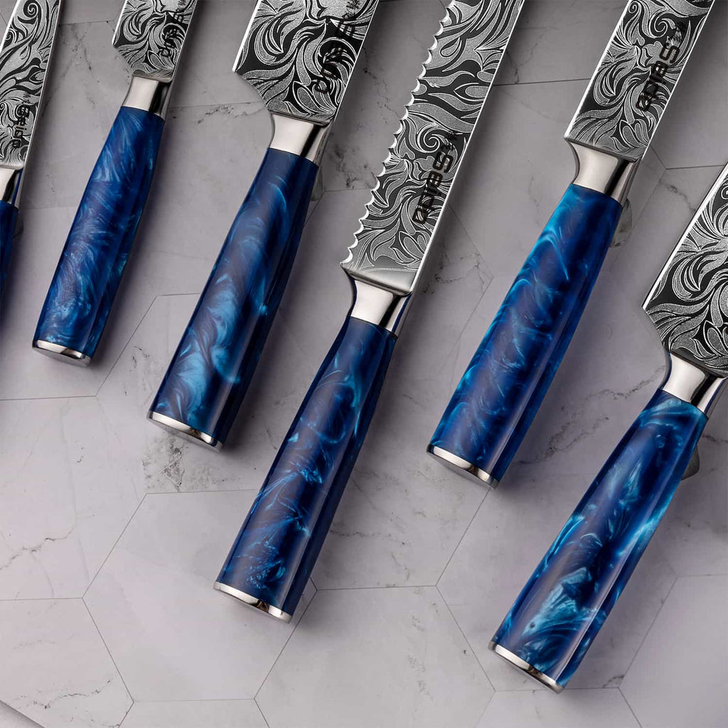 Close-up of Tengoku blue resin knife handles and stainless steel bolsters