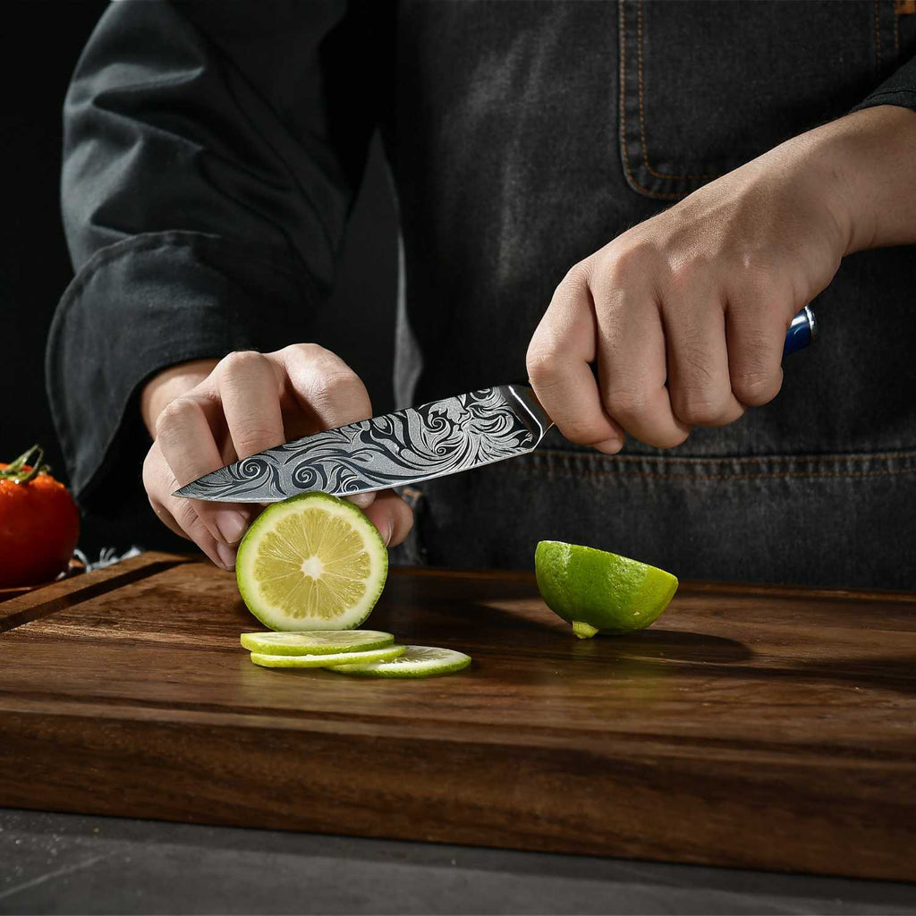 Damascus-pattern finish on Tengoku 10-piece Japanese chef knives with blue handles