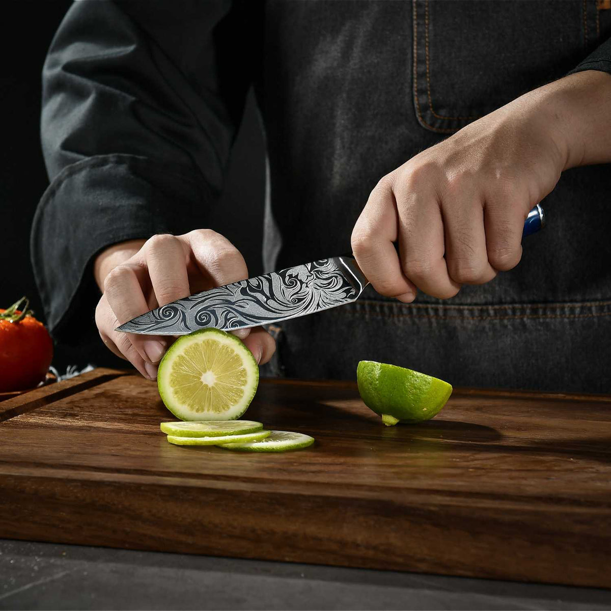 Damascus-pattern finish on Tengoku 10-piece Japanese chef knives with blue handles