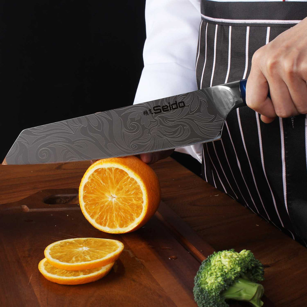 Tengoku Japanese knives with blue epoxy handles and double-bevel edges