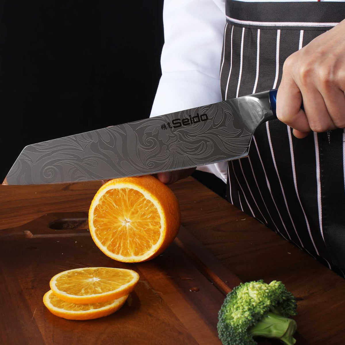 Tengoku Japanese knives with blue epoxy handles and double-bevel edges