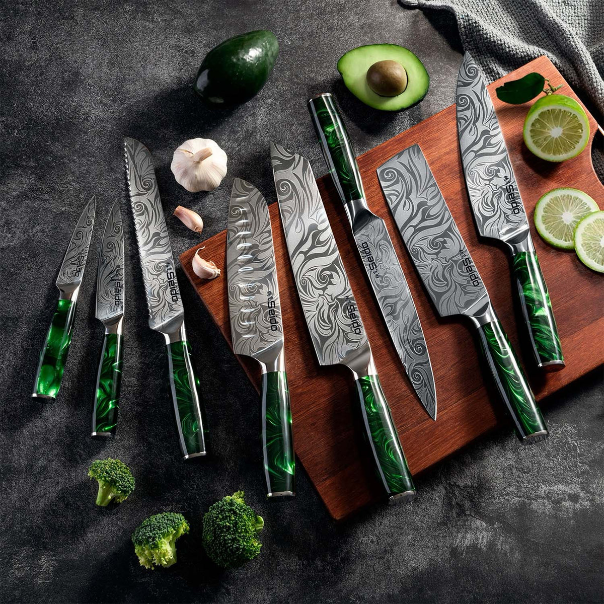 Tengoku 8-piece Japanese chef knife set with emerald green resin handles and Damascus-pattern blades
