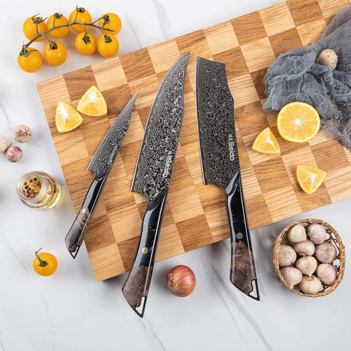 Titanium-coated VG-10 Damascus kitchen knives from the Titan 3-piece set