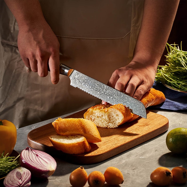 Damascus kitchen knife set: chef, santoku, cleaver, bread, boning, utility and paring knives