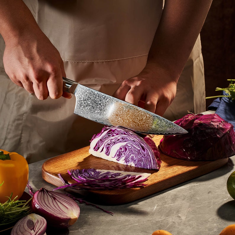 VG10 Damascus steel blade pattern on a sycamore wood handle kitchen knife