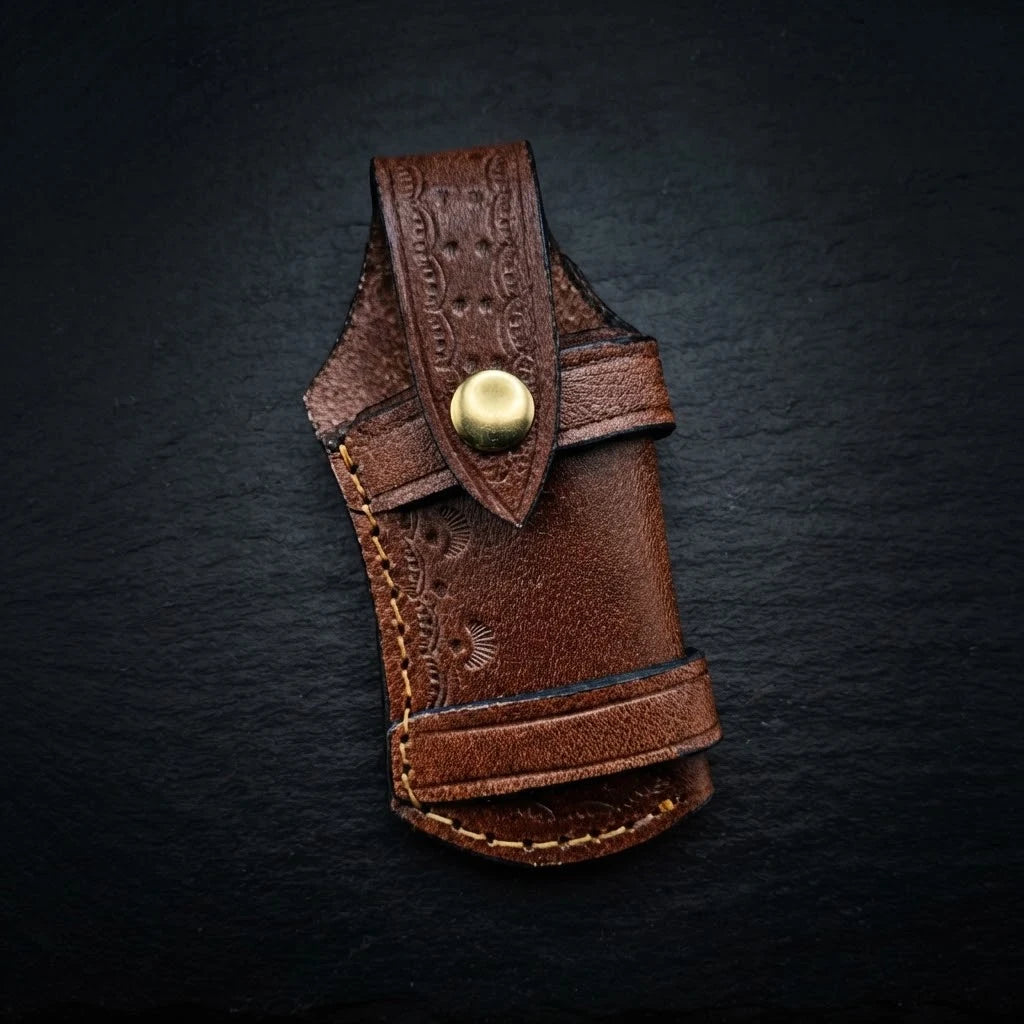 Walnut wood folding knife with engraved brass bolster and Damascus blade – folded with sheath