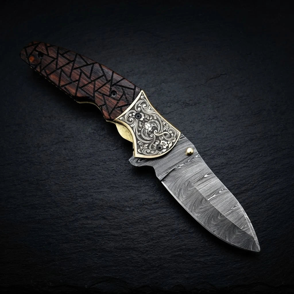 Walnut wood folding knife with engraved brass bolster and Damascus blade – handle detail