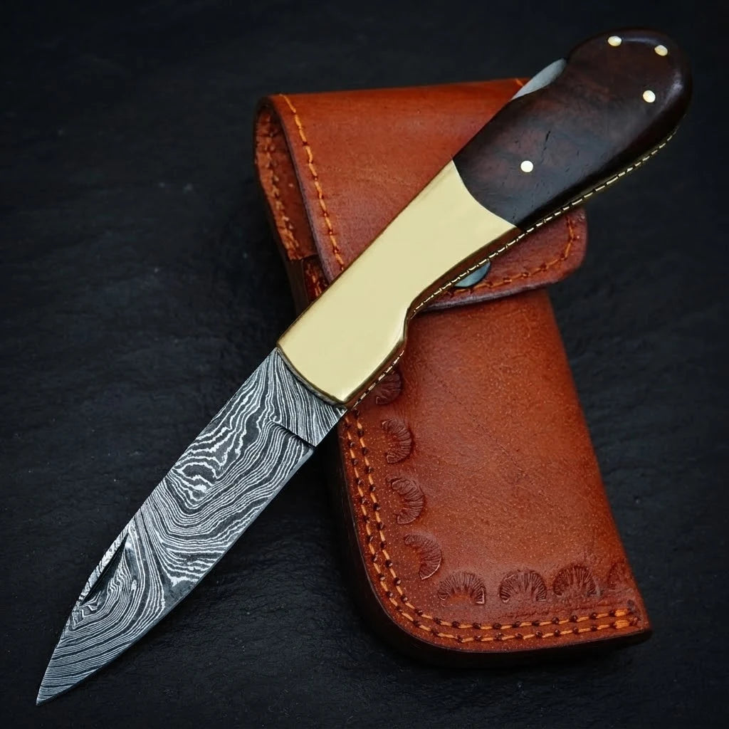 Handmade Damascus folding pocket knife with walnut wood handle and brass bolster