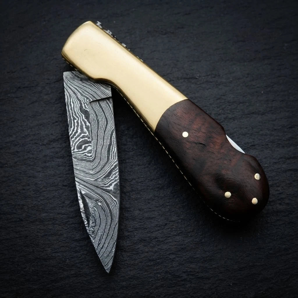 Damascus folding knife — walnut wood handle grain close-up