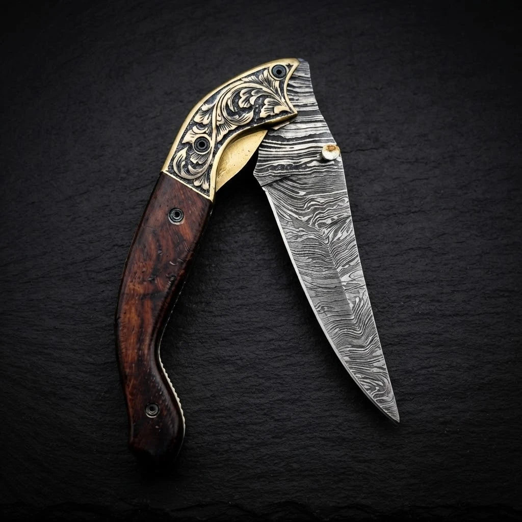 Damascus folding knife with walnut wood handle and engraved brass bolster – full view