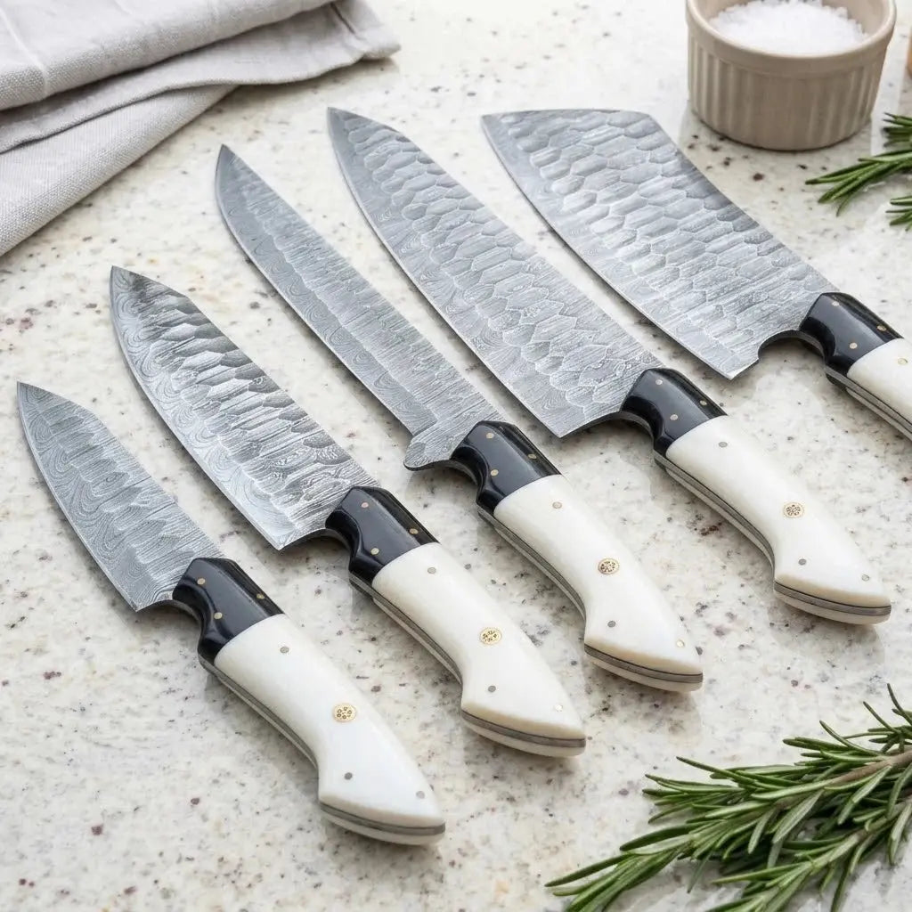 White resin handle Damascus kitchen knives with black G10 bolsters and brass pins